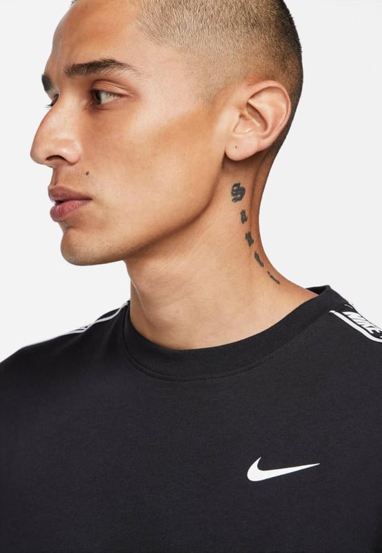 Nike Mens Repeat T Shirt.    Ribbed Crew Neck, Short Sleeve.     Soft Jersey Cotton Provides Lasting Comfort and Durability.     Repeat the Swoosh Graphics and Block Lettering So You Can Show the Love of Nike.