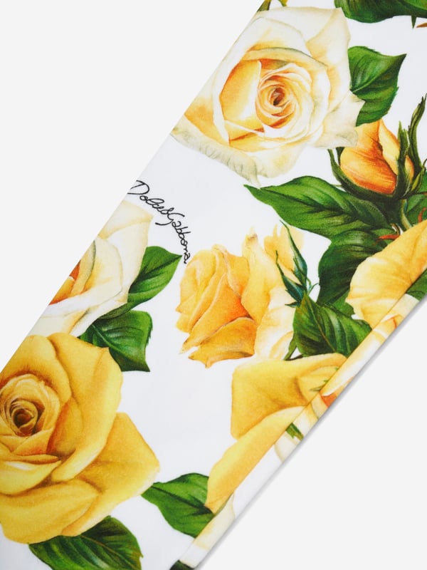 Dolce  Gabbana incorporate innovative materials with vintage abstracts into coexisting spaces. These girls rose leggings capture the Italian label's mesmeric craftsmanship and purity of design. As part of the girl‚ flowering collection, each piece is depicted in a veritable riot of yellow roses. Presented as interlock leggings with all-over yellow rose print. She will look and feel divine.  Made in Italy Multi-Coloured Regular Fit Stretch Waistband Placed Print Inner Leg: 47cm on Size 6 Years Hem: 10cm on Size 6 Years Print Placement Will Vary Due to  Aspect  External Composition: 90% Cotton, 10% Spandex