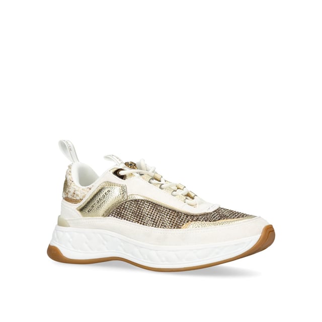 The Kurt Geiger London Kensington Sneaker features a multi-texture upper including crystal embellished houndstooth and suede eyestay. The tongue features a transparent branded monocle with antiqued brass Eagle head.