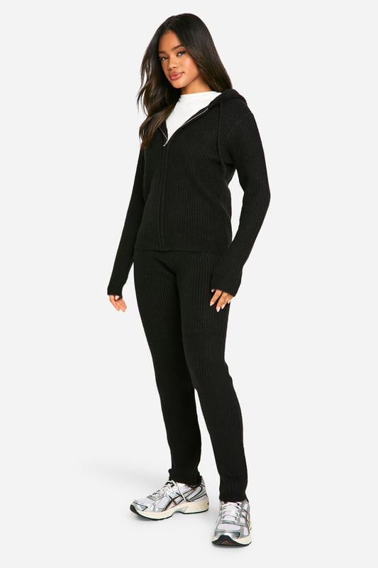 Soft fine knit texture for ultimate comfort
        Zip-through hoodie design for versatile styling
        Coordinating trousers for a complete look
        Ribbed cuffs and hem for a snug fit
        Relaxed silhouette perfect for lounging or casual outings
    
    Embrace laid-back chic with this soft fine knit tracksuit from Boohoo. The zip-through hoodie and coordinating trousers offer a seamless blend of comfort and style, ideal for those lazy weekends or casual catch-ups with friends. Layer the hoodie over a simple white tee, as shown, for a classic look, or wear it zipped up for extra warmth. The relaxed fit allows for easy movement, making it perfect for running errands or lounging at home. Pair with trendy trainers and a crossbody bag for an effortlessly cool ensemble. For a touch of athleisure, style with statement socks and slider sandals. This versatile co-ord set is a must-have addition to your casual wardrobe, offering endless styling possibilities for the fashion-forward Boohoo girl.