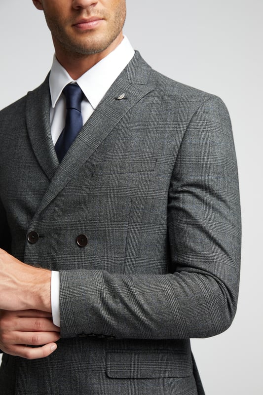 Slim Fit Pow Check Jacket Our Sagan suit jacket is here to make your formalwear look as sharp as ever. Crafted in luxurious wool blend with a charcoal blue pow check design, this double breasted slim fit jacket will make for a smart addition to your wardrobe. Complete with signature Ted Baker floral lining and a delicate leaf lapel pin, for guaranteed comfort and elegance.