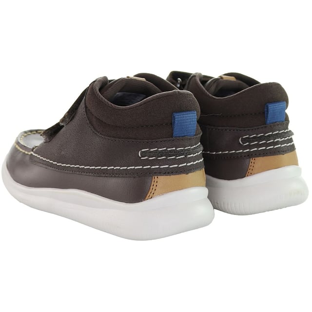The Clarks Crest Tuktu Kids Brown Shoes are likely a pair of comfortable and stylish footwear designed for children. Here are some features you might expect:

 Quality Materials:  Clarks is known for using high-quality materials in their footwear to ensure durability and comfort.

 Kid-Friendly Design:  The shoes are designed with children in mind, featuring elements that cater to their comfort and ease of use.

 Comfortable Insole:  Clarks shoes typically have a well-cushioned insole to provide comfort and support for young feet.

 Durable Outsole:  The outsole is likely designed to be durable and provide good traction, ensuring safety during playtime activities.

 Crest Tuktu Collection:  Specific details about the Crest Tuktu collection, such as unique design elements or branding, may be present on these shoes.