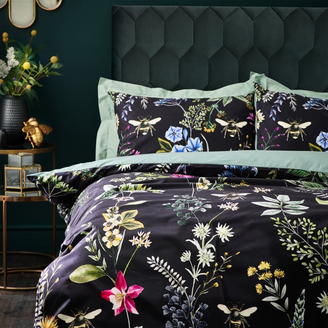 A striking digitally printed duvet set featuring an eye-catching contrast design, which will brighten up your bedroom in an instant, Busy bees hover among the bright, fresh florals of a meadow or garden, which are set on a contrasting luxuriously soft velvet jet black background. This exquisite set adds lovely pops of colour to your bedroom and gives it a natural feel too, helping you wake up in the morning and feel refreshed.
