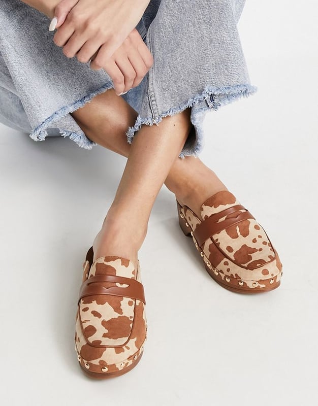 ASOS DESIGN Marleigh clog flat mules in tan cow printMulti