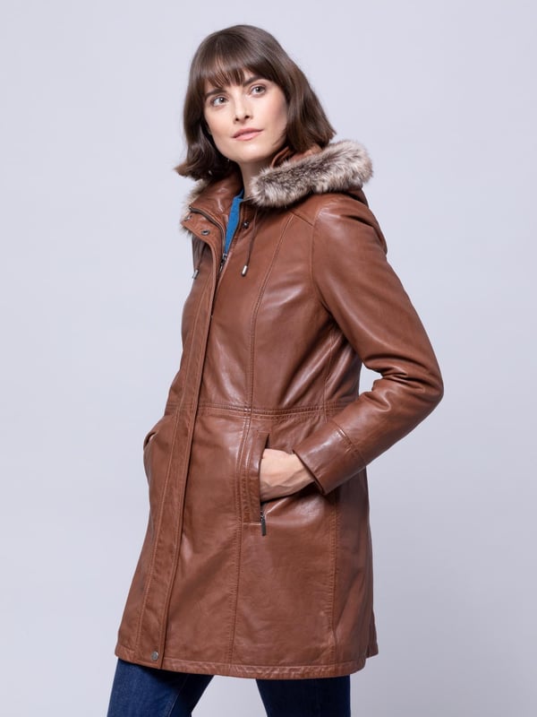 Ravensworth Long Leather Coat in Tan Make no mistake. The cold is coming. And there is no better protection against the elements than the Ravensworth long leather coat in a striking tan colourway. Not only designed to keep the cold at bay, we've crafted a flattering coat, with a long contoured panels to accentuate your figure.
Well-judged details include a detachable faux-fur trimmed hood, popper placket concealing a zip fastening, longline design, and a funnel collar. Stay warm this season and beyond.
We almost forgot to mention the sumptuously soft UK sourced aniline leather, with antique effect over-dye. It's easy to see why the Ravensworth is our new any-occasion hero.
Sizing
These measurements are based on a size 12 and will vary slightly between sizes.
Approximate centre back length: 84cm
Approximate sleeve length from shoulder to cuff: 63 cm
Approximate sleeve length from underarm to cuff: 44cm
The Details
Exclusive to Lakeland
Style Name: Ravensworth Long Leather Coat
Colour: Tan
Material: Aniline Leather
Fit: Easy Fit
Two zip pockets
Concealed zip front fastening
Faux fur trim
Removable hood
Funnel collar with toggle detail
And on the inside
Tonal satin lining