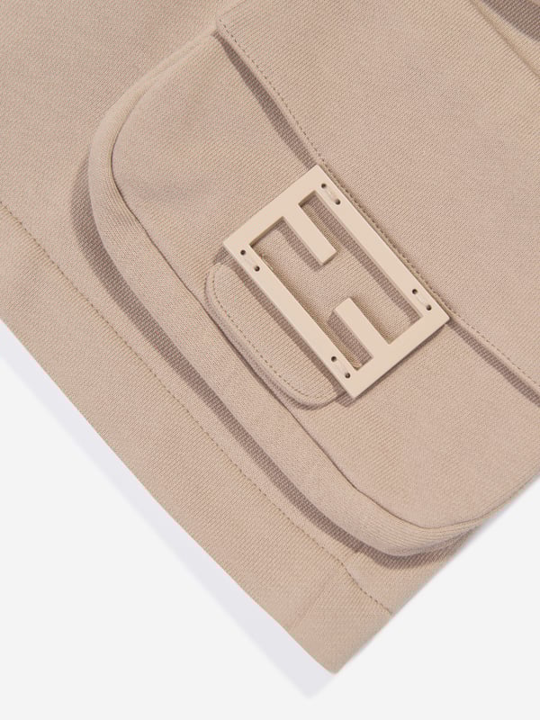 Introducing Fendi's Boys Baguette Pocket Cargo Shorts in Beige- a high-end designer piece from Italy that radiates luxury and style. Key features include: Exquisite Italian Craftsmanship: Immaculately tailored for durability and longevity in Fendi's Italian ateliers. Designer Appeal: The Baguette Pocket lends a statement, making these shorts a trendy addition to your boy's wardrobe. Supreme Comfort: Crafted from premium fabrics to provide utmost comfort, perfect for your little one's daily escapades. Must-have Beige: A versatile colour that complements all, these shorts will add a touch of elegance to his outfit. Elevate your boy's style quotient with this exclusive piece from Fendi. Order now to make a fashion statement that's hard to ignore!