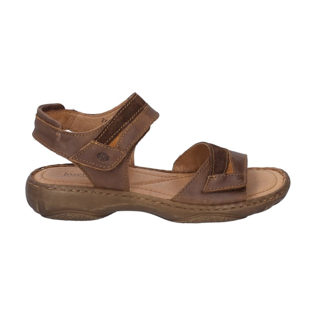 Mit der Debra 19 Sandale von JOSEF SEIBEL, in der Farbe castagne/kombi, erlebst du den Sommer von seiner besten Seite. Dieser Damenschuh vereint traditionelle Handnaht mit modernem Design und bietet durch die PU-Sohle außergewöhnliche Dämpfeigenschaften, die jeden Schritt leicht machen. Das Obermaterial sowie das Fußbett aus Leder garantieren ein angenehmes Tragegefühl und machen die Sandale zum idealen Begleiter für jegliche Freizeitaktivitäten im Freien. Dank des praktischen Klettverschlusses lässt sie sich schnell an- und ausziehen. Die Debra 19 ist ein Paradebeispiel für Slow Fashion, geprägt von der Spirit of Nature Kollektion, die für ihren charakterstarken Designansatz und den hohen Tragekomfort steht. Entdecke, wie dieser Schuh mit seiner einzigartigen Fertigungsart echte deutsche Industriekultur verkörpert und setze ein Statement gegen Fast Fashion.