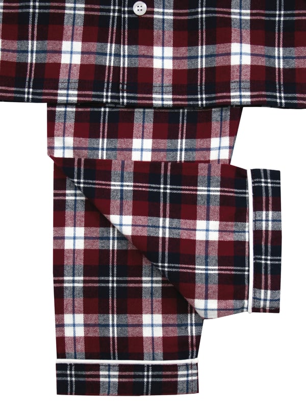 Boys Jordan Burgundy Check Traditional Pyjamas

Your little boy will look SO grown up in these traditional check fabric Pyjamas. 100% brushed cotton which is soft and cosy against the skin. This PJ set has lots of extra details like engraved buttons and white piping on the collar and cuffs. Just like a grown up pair of Pyjamas only smaller! 
It’s easy to create mini-me looks with our Jordan Check range as coordinating styles are also available in our adult collection.
Little known fact: the secret to a good night's sleep is a great pair of pyjamas. Our fan favourite classic two-piece PJ sets are made with 100% cotton and they're full of classic details and checks. Your little one will want to wear these awesome pyjama set all day long!
Sold as a Pyjama set.
Fabric: 100% cotton - Warm brushed cotton
Fire Warning : KEEP AWAY FROM FIRE AND FLAMES.
Wash Care Instructions : Machine wash inside out, do not soak, wash dark colours separately, do not iron trims. Save energy and wash at 30 degrees.
Do not tumble dry.