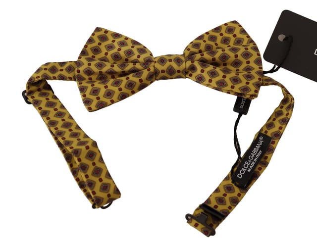 100% Authentic Dolce & Gabbana bow tie
  Exclusive design from the Dolce & Gabbana collection
  Color: Yellow with pattern
  Model: Tied
  Material: 100% Silk
  Adjustable length neck strap one size
  Made in Italy
Material: 100% Silk
