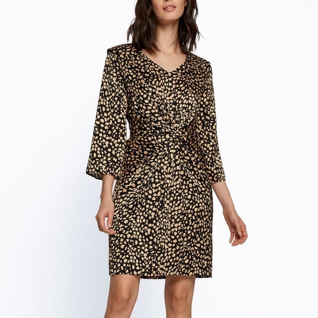 Constructed with long sleeves and a V neckline for a classic look  it features elasticated hems for a comfortable fit. This dress is an all over print design with a signature logo and is complete with BOSS branding.