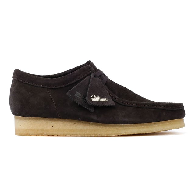 The iconic Clarks Wallabee shoe in boot style. The moccasin-inspired, structured silhouette offers clean and simple lines. Crafted from suede, the Wallabee boots features a lace up fastening and distinctive crepe sole.