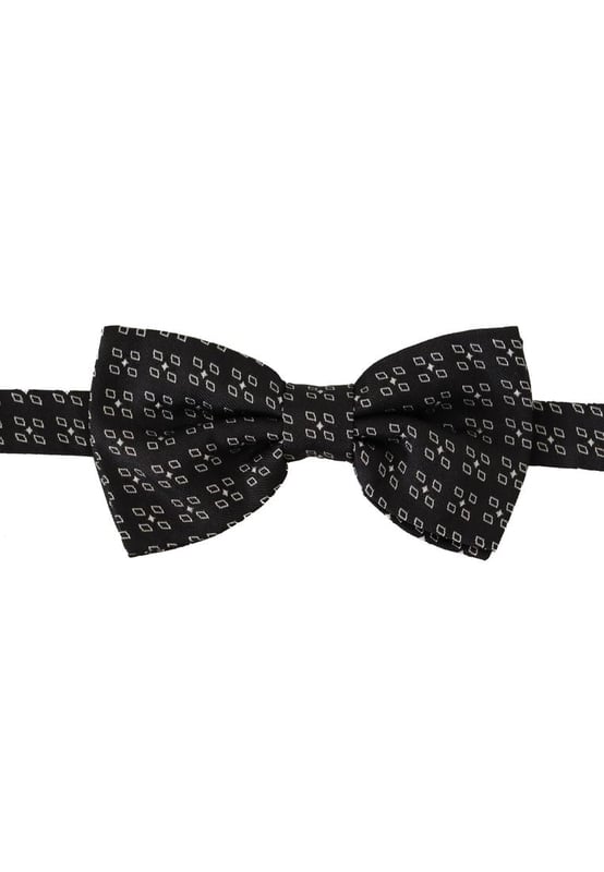 Stunning Dolce & Gabbana silk bow tie
  Black and white polka dot design
  Made from 100% silk
  Adjustable length neck strap
  Made in Italy
  Width: 6cm
Material: 100% Silk
