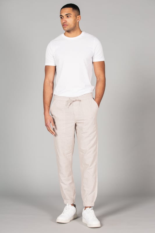 Upgrade your wardrobe with these linen trousers from Tokyo Laundry, featuring a classic fit and drawstring waist for added comfort. Made from a breathable blend of linen and cotton, these trousers are perfect for both casual and formal occasions. Machine washable for easy care, they are a versatile addition to any wardrobe.