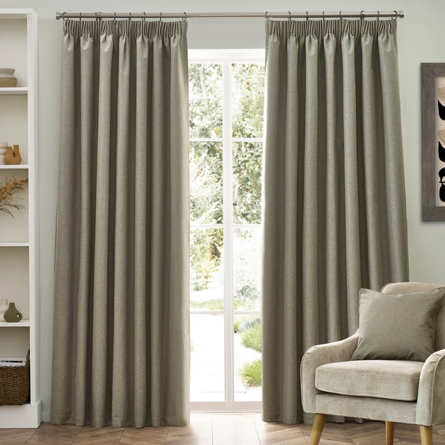 Transform your living space with Dawn Blackout Pencil Pleat Curtains, designed for those who value elegance and practicality. Crafted from soft-textured fabric with a modern marl effect, these curtains add refined style to any room while effectively blocking out light. Perfect for a restful night's sleep or creating the ideal movie-watching environment, their temperature-regulating properties ensure comfort year-round by keeping your home cool in summer and warm in winter. Enjoy the perfect blend of function and style with Dawn Blackout Curtains.