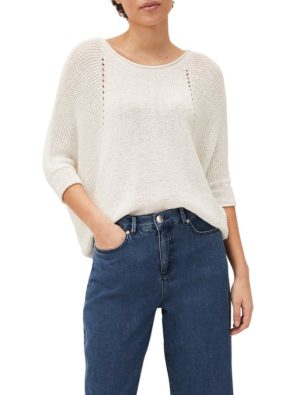 This style is responsibly sourced. We're proud to invest in making cotton production more sustainable. A textured tape yarn jumper complete with batwing sleeves and contrast stitch detailing. Finished with a curved extended hem at the back for a flattering fit. This semi-sheer style is best worn with a camisole underneath.
