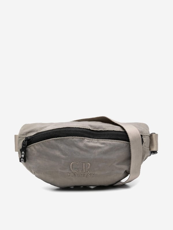 Introducing the Boys Logo Belt Bag in Green by CP Company‚ an essential accessory for AW2024, blending high-end craftsmanship with functional design. Key features include:‚ Signature CP Company Aesthetics: Showcases the iconic logo in a vibrant green hue, ensuring standout style.  ‚ Ergonomic Design: Perfectly sized for boys, with adjustable straps for a comfortable, custom fit.  ‚ Durable Material: Crafted from premium materials, built to withstand daily wear and tear.  ‚ Versatile Accessory: Elevates any outfit, from casual to chic. Ideal for everyday adventures or special occasions.Add this stylish and sturdy piece to your boy's wardrobe today!