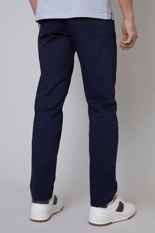 Elevate your everyday staples with this two pack of stretch chino trousers from Threadbare. Cut in a regular fit with two side pockets, these chino trousers have belt loops, a metal zip fly and mock horn button to close. Complete with two back welt pockets, two side pockets and a coin pocket. Made from a durable cotton twill fabric blended with elastane for a comfortable fit. Team with a T-shirt and open shirt for weekend style, or add a fine knit jumper for a practical workwear look.