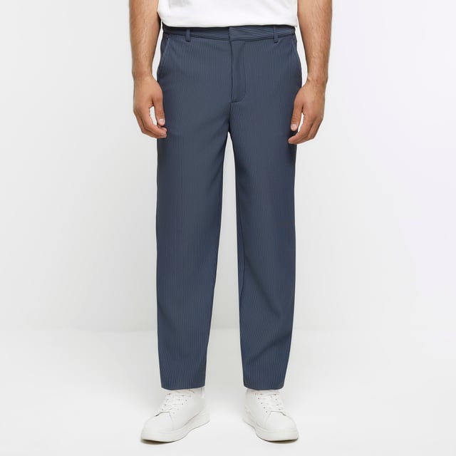 Tapered fit, Pleated fabric, Side slip pockets, Belt loops, Concealed zip and button fastening