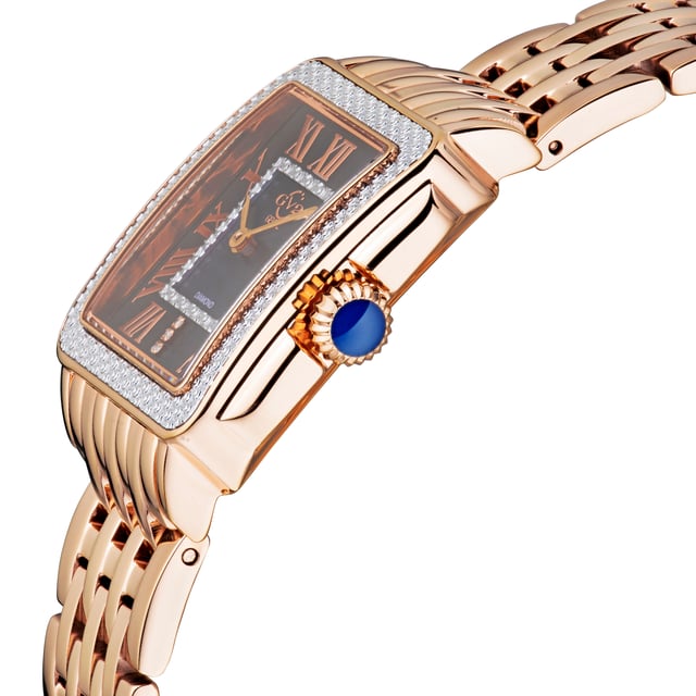 Decadence is in the details.      The Padova Collection by Gevril shares its name with the Italian city that has inspired artists for centuries. From Shakespeare to Giotto, Padova has set the stage for numerous timeless works of art, so it’s only fitting this series of watches features delicate detailing and expert craftsmanship. From the stunning, diamond cut ring dial to the anti-reflective sapphire crystal face, each enthralling element of this timepiece is made to precision. Contrasting roman numeral markers surrounding the face contrast with the dial, and 3 diamonds lay nestled at the VI mark. The square bezel is available in a myriad of metals and features a push-pull crown. This Swiss-Movement watch is water resistant for 30 meters. Dazzle in diamonds and enduring elegance with a timepiece from the Padova Collection.

GV2 12306B Women's Padova Swiss Diamond Watch

GV2 Women's Swiss Watch from the Padova Collection
28.5 mm Rectangle Rose Gold Case, Push Pull crown
Stunning Black MOP dial with Diamond Cut ring on Multicolored MOP inner dial, 3 Diamonds at 6.00

IPRG Stainless Steel Bracelet with Deployment Buckle
Anti-reflective Sapphire Crystal
Water Resistant to 30 Meters/3ATM
Swiss Movement Ronda 762