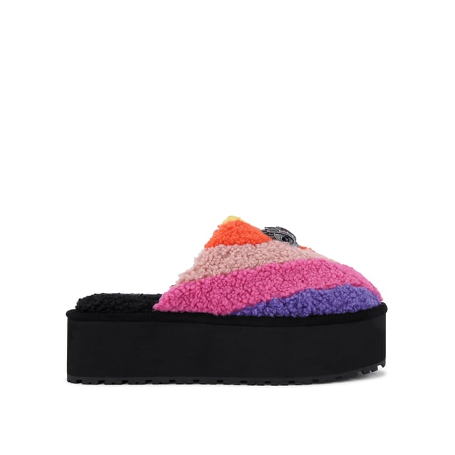 This Kurt Geiger Kensington Pump Slippers has a faux shearling upper in a rainbow stripe design. There is an antiqued silver eagle head with rainbow crystals on the toe. Sole height: 5cm.