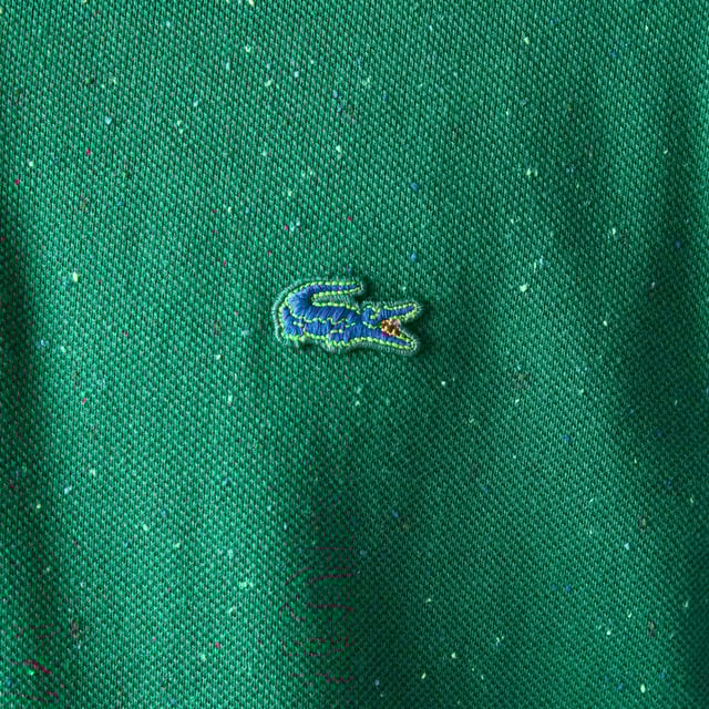 Finest materials. Brand’s singular expertise. The perfect expression of Lacoste’s timeless wardrobe The perfect twisted basic polo with neps effect. Classic fit  comfortable ease on body and sleeves : the original shape Multicolor neps effect on petit pique  mother of pearl 2 buttons placket 3cm multicolored crocodile at chest. Material: 97% Cotton, 2% Viscose, 1% Polyester. Ref: PH23637BS.