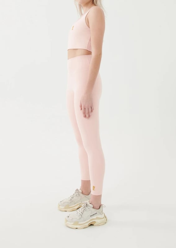 High rise 7/8 length leggings. P.E Nation logo on ankle. Compressive feel leggings made for low impact activity