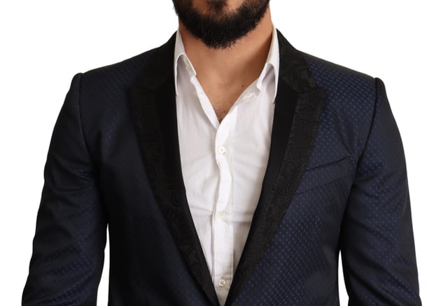 Stunning Dolce & Gabbana MARTINI Slim Fit Blazer Jacket
  Single breasted one-button style
  Slim fit for a great fitting and comfort
  Beautiful blue color
  Three outside pockets and two inside pockets
  One open vent in the back for breathability
  Logo details for a signature touch
  Made in Italy with premium materials
  Material: 6% AC 50% PL 11% Silk 33% Wool
  Lining: 100% Silk
Material: 6% AC 50% PL 11% Silk 33% Wool