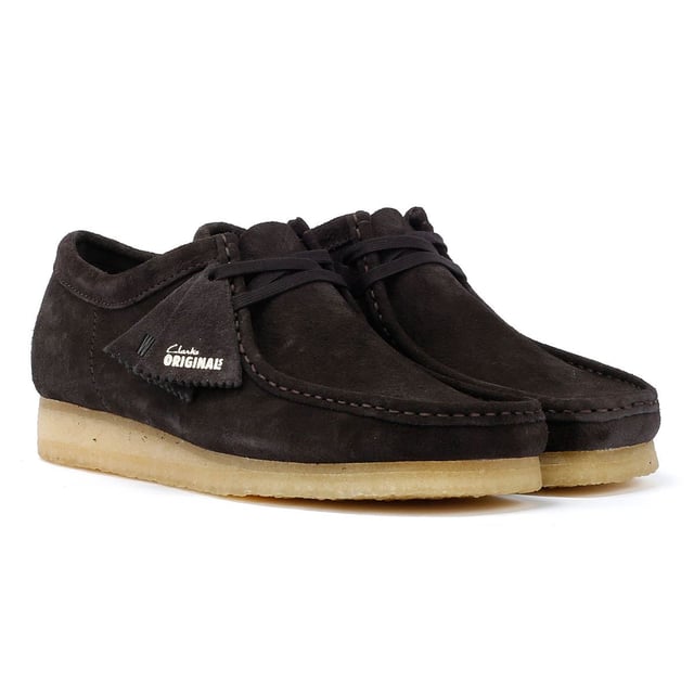 The iconic Clarks Wallabee shoe in boot style. The moccasin-inspired, structured silhouette offers clean and simple lines. Crafted from suede, the Wallabee boots features a lace up fastening and distinctive crepe sole.
