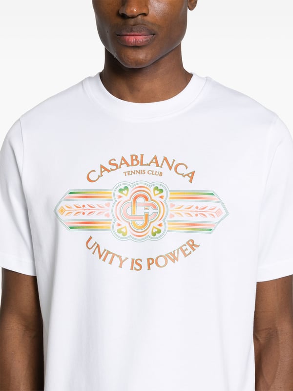 Crest-inspired graphics pepper Casablanca's designs, alluding to the brand's sports-club inspiration. This short-sleeve organic-cotton T-shirt is highlighted with the Unity is Power print, a motif that conveys an important message from the brand's latest collection.