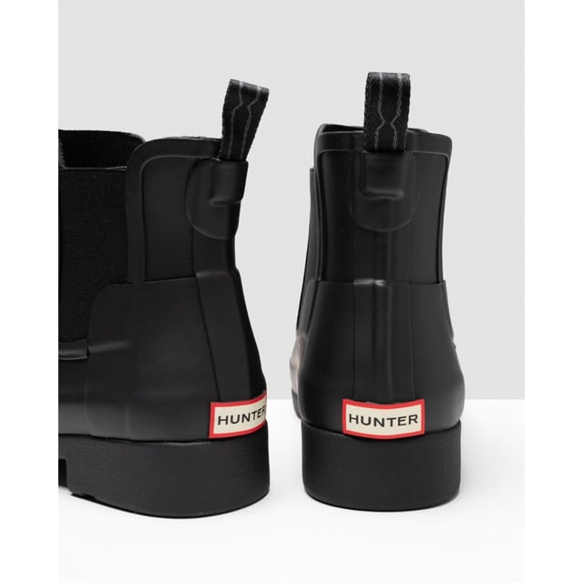 With a slimmer fit ideal for city-living, the Women's Refined Chelsea features a tailored shape and moulded footbed for everyday wear. A rework of the classic ankle boot, each boot is ready for rain and handcrafted from natural rubber which has been vulcanised for superior protection. Retaining the iconic features of the traditional Chelsea, elasticated gussets and a nylon pull tab make for easy wear. Perfect for everything from city commuting to last minute lunches, this waterproof boot in classic black is a wet weather essential.
We recommend that all Hunter Chelsea boots be worn with Hunter Chelsea socks, which have been technically designed to protect the wearer's skin from contact with rubber in specific areas.
&nbsp;

&nbsp;

Waterproof
Handcrafted
Polyester lining
Elastic side gussets and nylon pull-tab
Rubber outsole with Hunter Original tread pattern
Moulded foot bed for enhanced comfort and support
Crafted from natural vulcanised rubber with matte finish

&nbsp;