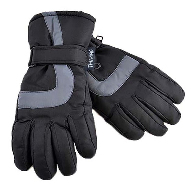 For your little skier, we've got the perfect accessory. These Kids THMO Ski Gloves with a 3M Thinsulate lining will keep them warm and comfortable. They're thick, cozy, and protective, so they'll make any trip to the slopes fun and safe. With expert insulation and waterproofing, these gloves are made for all types of cold weather especially snow and rain. The protective cuff will protect their wrists from the wind and snow and they include an adjustable velcro strap to make sure these gloves are perfectly comfortable. They're made out of 100% polyester material and have 3M Thinsulate lining on the inside as well as extra padding so they'll stay warm even in sub-zero temperatures which is perfect for a day of skiing or snowboarding with family. Thinsulate is well known for keeping you warm and is considered one of the most effective linings. The purpose of the lining is to hold warm air inside the gloves and to keep the hot air close to your skin. The THMO logo badge is on the cuff, separating your glove fashion from the rest. Remember... BE WARM, THINK THMO. They are available in Black and come in 4 size options: 6-7 Years, 8-9 Years, 10-11 Years & 12-13 Years. They are 100% Polyester and are Machine Washable.