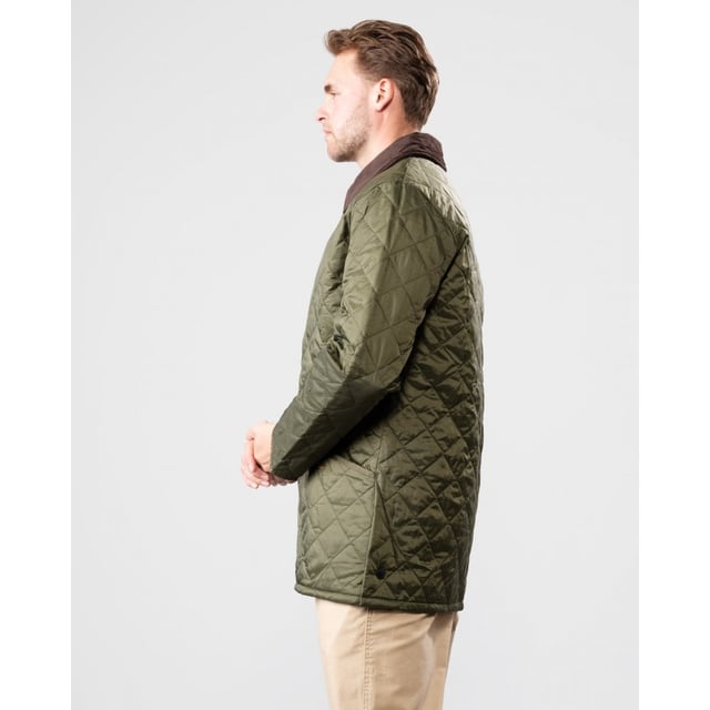The Liddesdale provides plenty of room for laying and a generous fit, we suggest you go down one size if you prefer to wear this as a summer jacket. One of the most iconic Barbour jackets, the original Liddesdale jacket is a firm favourite year after year.
With Barbour's signature diamond quilted outer and a warm yet lightweight contrast nylon lining, this popular men's quilted jacket is durable, simple and stylish. From the Classic collection and available in a range of wearable colours, it features a robust front stud fastening to protect from the elements, and a smart sit-down cord collar that can be raised for additional warmth and protection, with a luxuriously soft feel against the skin.
With a generous fit, the Liddesdale provides plenty of room for layering up with chunky knits and insulating gilets, while the studded rear vents ensure comfort and ease of movement. The signature front patch pockets are trimmed with contrast Barbour embroidery and are generously proportioned, while a zipped inner security pocket safeguards valuables. A timeless addition to any winter wardrobe.

Regular Fit
100% polyamide
Two inch box quilted with 100g polyester wadding
Machine washable
Back length: 30-34in / 76.3-86.3cm