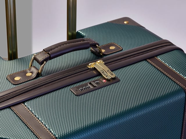 Introducing the Parker Soft Shell Suitcase – a remarkable fusion of strength and versatility designed to meet the demands of modern travelers. This innovative luggage piece combines an ultra-strong polypropylene frame with a fabric body, offering a perfect balance of durability and flexibility.

Product Design Features:

Durable Fusion: The Parker Soft Shell Suitcase combines the strength of an ultra-strong polypropylene frame with the flexibility of a fabric body, ensuring resilience and versatility.
Carry-On Convenience: Sized for carry-on use, it features an easy-access laptop section and a removable waterproof pouch for added practicality.
Expandable Capacity: Medium and Large sizes come equipped with Parker's expander zip, providing additional packing space to accommodate varying travel needs.
Effortless Mobility: With eight smooth-rolling wheels and a telescopic handle, this suitcase ensures effortless gliding, making your travels hassle-free.
Enhanced Security: An integrated TSA combination lock offers security and peace of mind for your belongings.
Innovatively designed, the Parker Soft Shell Suitcase includes a zipped front pocket for convenient storage and quick access to smaller items. Inside, a fully lined interior features a zipped mesh pocket and elasticated packing straps for organized packing. Experience the best of both durability and functionality with this exceptional travel companion. Important Note: Please select preferred size. Sizes sold individually, not in a set.