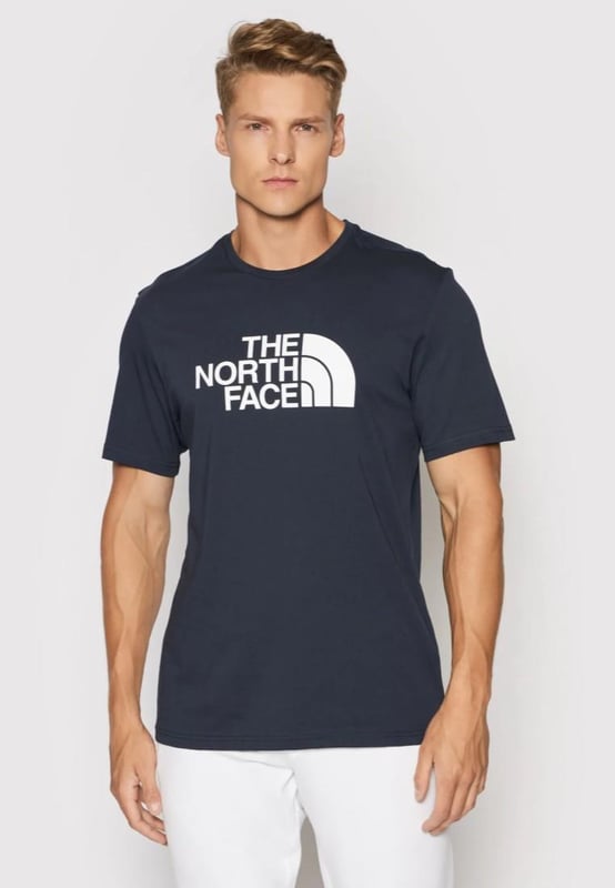 The North Face Mens Short Sleeve Easy Tee.     
Pressed Plastisol Print at Front.     
The North Face Logo on the Back of the Shoulder.     
Classic Length Short-sleeve T-shirt With Crew Neck.      
100% Cotton.     
Machine Washable (Please See Care Label).     
The North Face Mens T Shirt TNF Short Sleeve Crew Neck Cotton Casual Easy Tee.