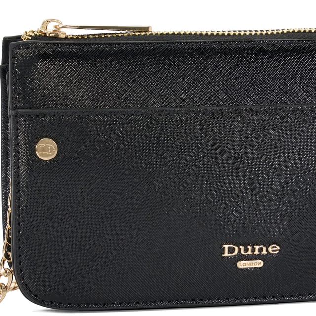 Meet Kingstono, the ultimate plus-one for any occasion. This textured purse is crafted from premium materials and features a secure zip closure, ensuring your essentials stay safe all day and night long. Adorned with chic stud embellishments and a versatile chain strap, this accessory can be taken to brunch or on a glamorous night out.