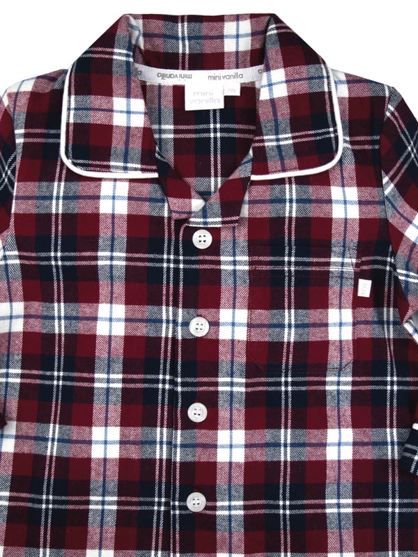 Boys Jordan Burgundy Check Traditional Pyjamas

Your little boy will look SO grown up in these traditional check fabric Pyjamas. 100% brushed cotton which is soft and cosy against the skin. This PJ set has lots of extra details like engraved buttons and white piping on the collar and cuffs. Just like a grown up pair of Pyjamas only smaller! 
It’s easy to create mini-me looks with our Jordan Check range as coordinating styles are also available in our adult collection.
Little known fact: the secret to a good night's sleep is a great pair of pyjamas. Our fan favourite classic two-piece PJ sets are made with 100% cotton and they're full of classic details and checks. Your little one will want to wear these awesome pyjama set all day long!
Sold as a Pyjama set.
Fabric: 100% cotton - Warm brushed cotton
Fire Warning : KEEP AWAY FROM FIRE AND FLAMES.
Wash Care Instructions : Machine wash inside out, do not soak, wash dark colours separately, do not iron trims. Save energy and wash at 30 degrees.
Do not tumble dry.