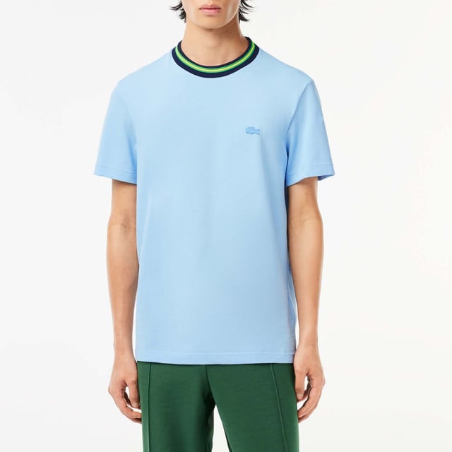 Men's Lacoste Stripe Collar Stretch Piqué T-Shirt.- Regular fit, natural ease on body.- Stretch mini pique, made of organic cotton and elastane.- Striped ribbed collar with contrasted tipping detail.- Tone on tone crocodile at chest. Material: 94% Cotton, 6% Elastane. Ref: TH1131HBP.