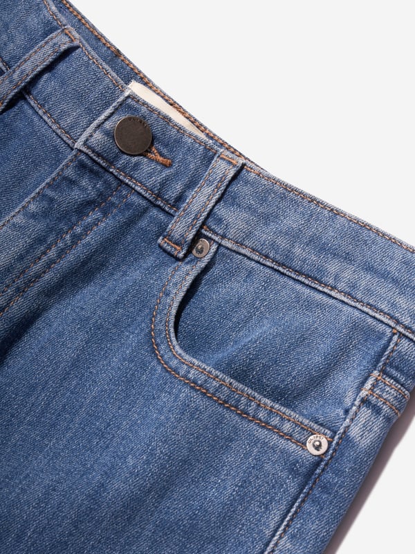 Introducing the Kids Zeke Wide Leg Jeans in Blue, expertly crafted by DL1961 for a fashionable unisex style. Elevate your child's clothing collection with these distinctive features: Sophisticated Design: This piece boasts wide-leg styling, embracing the ongoing trend for a statement look. Superior Comfort: Crafted from soft, high-quality denim, these jeans offer tailor-made comfort for your child's daily escapades. Exquisite Colour: The bold blue hue guarantees a chic and stylish wardrobe upgrade. Unisex Versatility: These jeans are designed for both boys and girls, ensuring an effortlessly cool look. Revamp your kids' wardrobe with the Kids Zeke Wide Leg Jeans in Blue from DL1961. Let your little ones lead in style!