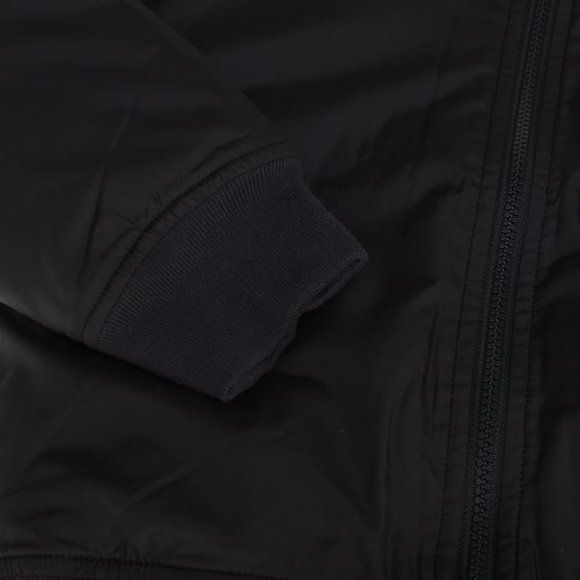 Bomber jacket for children with a modern and functional design.

 It features a high, banded collar for added protection in cool weather, and long sleeves with fitted cuffs for a comfortable fit.

 The front zip closure makes it easy to put on, while the front slanted pockets add a practical and stylish touch.

 Additionally, it includes a zippered chest pocket, providing additional space for small items.

 The banded hem ensures a secure fit, keeping the jacket in place.

 This garment is perfect for keeping children warm, combining style and practicality in an ideal option for everyday use.
 Composition: Shell: 100% Polyester; Lining: Acrylic; Interior: 100% Polyester, Filling: 100% Polyester
 Care:
- Machine wash cold on delicate cycle.
 - Use mild detergents.
 - Use dryer at low temperature.
 - Iron at low temperatures.
 - Do not dry clean.