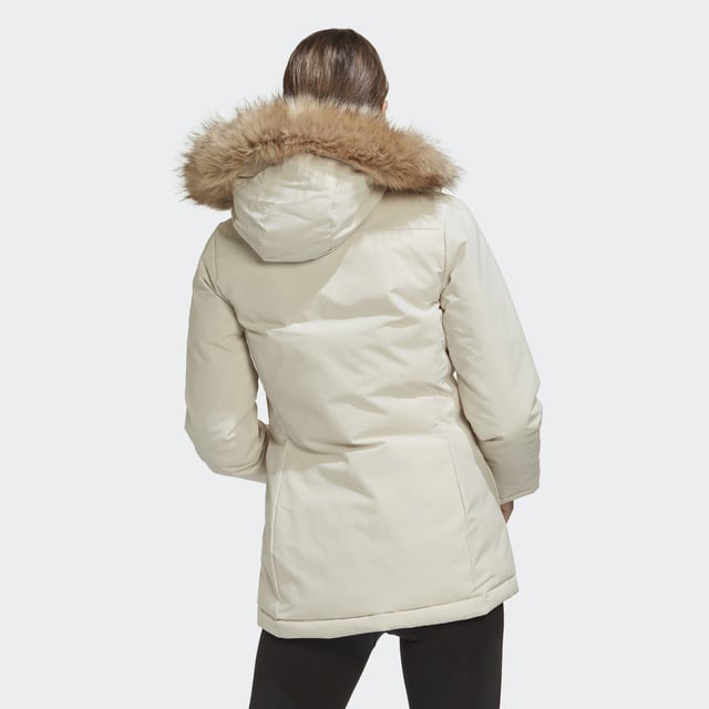 Nothing is the same two days in a row. Not in nature. Not in the city. Be prepared for all the weather shifts in this adidas parka. Padded for warmth, this do-it-all jacket also has adjustable cuffs and a cosy hoodie to help keep the cold out. Removable faux-fur trim lets you customise the look.This product is made with recycled content as part of adidas' ambition to end plastic waste.  - This model is 175 cm and wears a size S. Their chest measures 81 cm and the waist 60 cm. - Regular fit - Full zip with hood - Shell: 100% nylon plain weave with durable water-repellent (DWR) coating - Fill: 100% recycled polyester padding - Front patch pockets - Hook-and-loop adjustable cuffs  Shipped by adidas