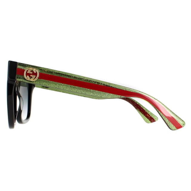 Las gafas de sol Gucci Square para mujer en negro con degradado gris de purpurina verde y roja GG0034SN son una montura glamurosa y sobredimensionada de forma cuadrada. La montura de acetato grueso es ligera y cómoda, con el emblemático logotipo metálico GG de Gucci en cada una de las patillas. Un estilo impresionante que siempre va a la última.
