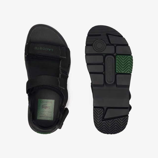 • Padded neoprene cushioning under straps • Synthetic leather footbed • Rubberised print Lacoste wording to front strap • Crocodile heel branding to rear strap • Lightweight rubber outsole with colour-blocked sections.
