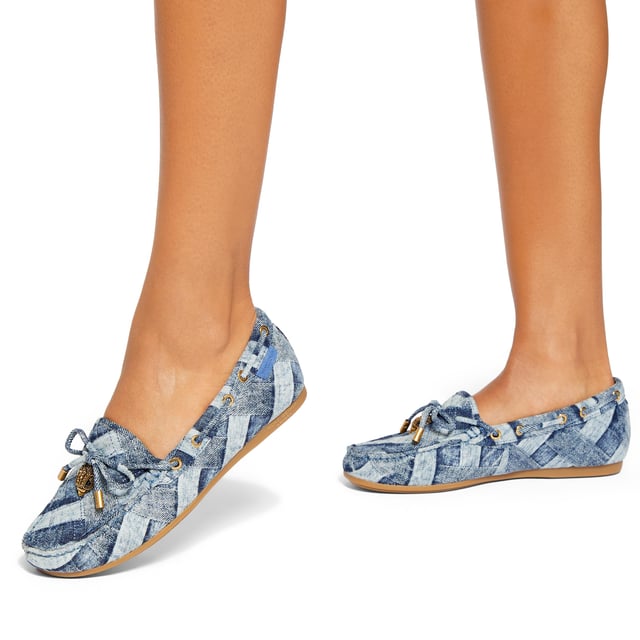 The Eagle Moccasin from Kurt Geiger is a slip on loafer. The upper is crafted from a denim with weave effect. There is a bow with antiqued brass eagle on each toe.