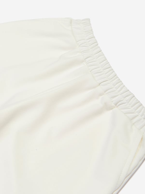 Mama Luma incorporate beautiful eco-friendly materials into their sophisticated handmade constructions. These girls ecru joggers are reflective of the Californian label's precision of beauty. They showcase an elasticated waistband and side pockets for a sleek, effortlessly stylish look. ‚ Handmade‚ 50% Viscose ‚ 45% Polyester ‚ 5% Elastane