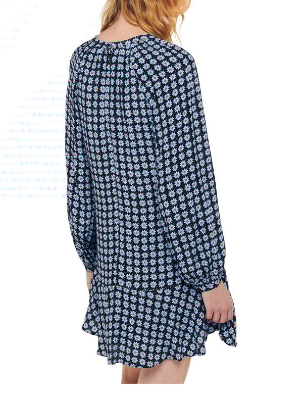Embrace elegance with the Dot Flippy Dress, perfect for any occasion with its charming floral dot pattern and flippy hem.