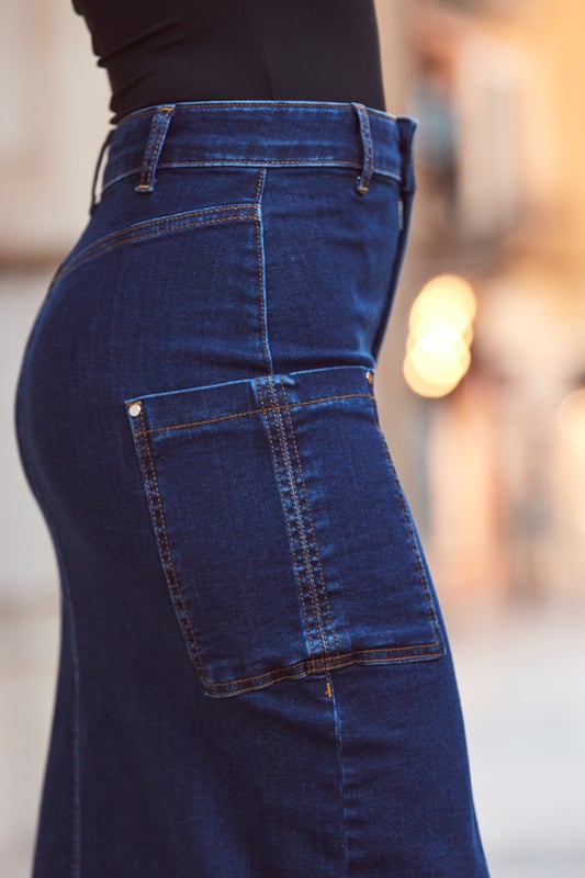 REASONS TO BUY:

Style points guaranteed
Crafted from our signature soft stretch denim
Trending cargo pockets
Denim midis are having a moment
Front split for added sexiness
Just add a knit and knee-highs
