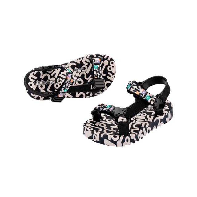 Experience unmatched fun and fashion with the Mini Melissa Playtime + Fabula - the sport sandal (papete) you never knew your mini desperately needed! The silhouette and has treaded soles and velcro straps with M logos. The insoles feature a unique, colorful print that is the perfect extra detail for a sunny day.