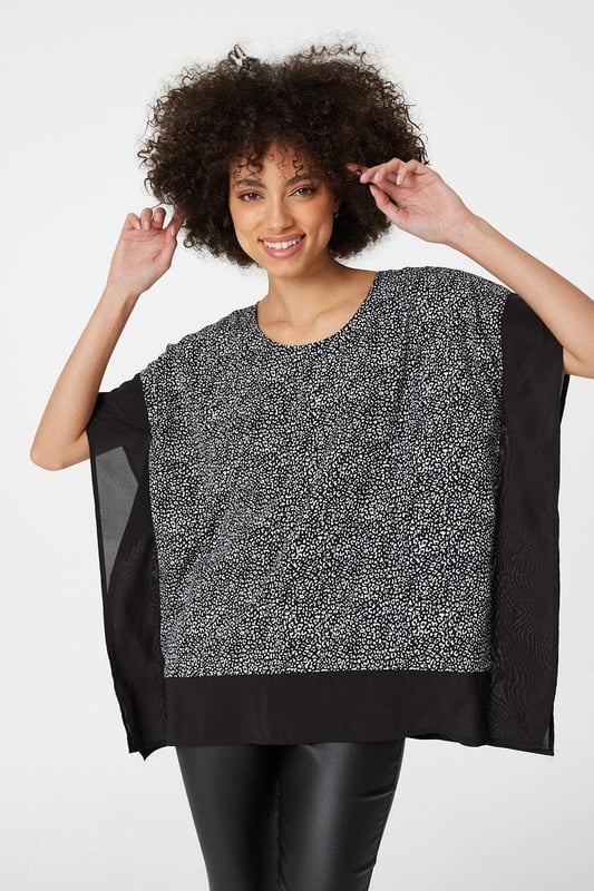 Make a statement with this leopard print poncho blouse top. It has a round neck, short sleeves, an oversized fit and a thigh length hem. Pair with fitted trousers and heeled wedges for a standout style that's perfect for date night or drinks with the girls.