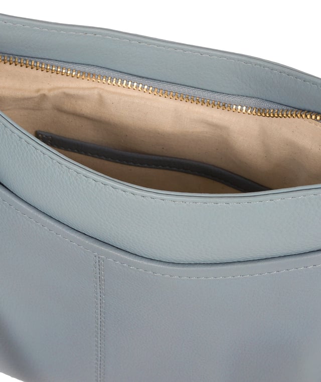 The 'Lewes' cross body bag from Pure Luxuries London, is crafted from naturally milled leather with a beautifully distinct fine-grain feel. A zip-over top secures a gorgeous, 100% natural cotton-lined interior with two slip pockets. On-the-go storage comes in the form of an exterior zipped pocket and two slip pockets, complemented by an adjustable and matching leather shoulder strap. Furnished with gold coloured metal fittings and the elegant Pure Luxuries London charm and logo plate.