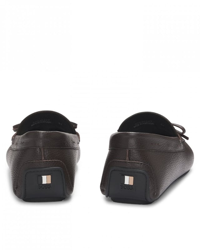 Slip-on moccasins with a durable driver outsole and bow vamp trim by BOSS Menswear. This pair is crafted in leather with a natural grain.

Fastening top: Slip-on
Fully lined
Packaging: Box

Upper material: 100% Cow skin, Lining: 90% Polyamid, 10% Polyurethane, Sole: 100% Thermoplastic polyurethane, Innersole: 90% Polyamid, 10% Polyurethane
50536247
 